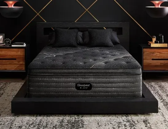 beautyrest dark mattress with matching black cushions and bed stand